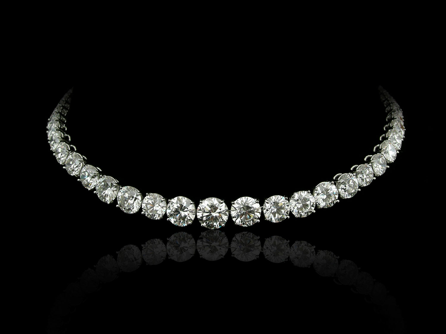 picture of a diamond necklace on a black background